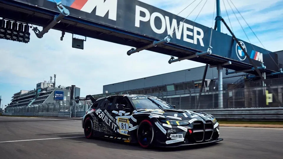 A BMW M3 Touring race car on a bridge